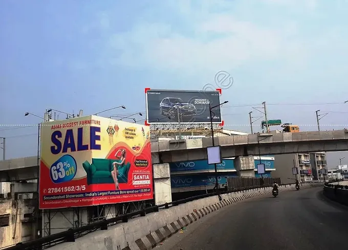 Santia Furnitures sale hoarding on flyover