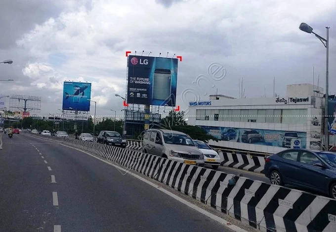 LG billboard on a highway with cloudy skies